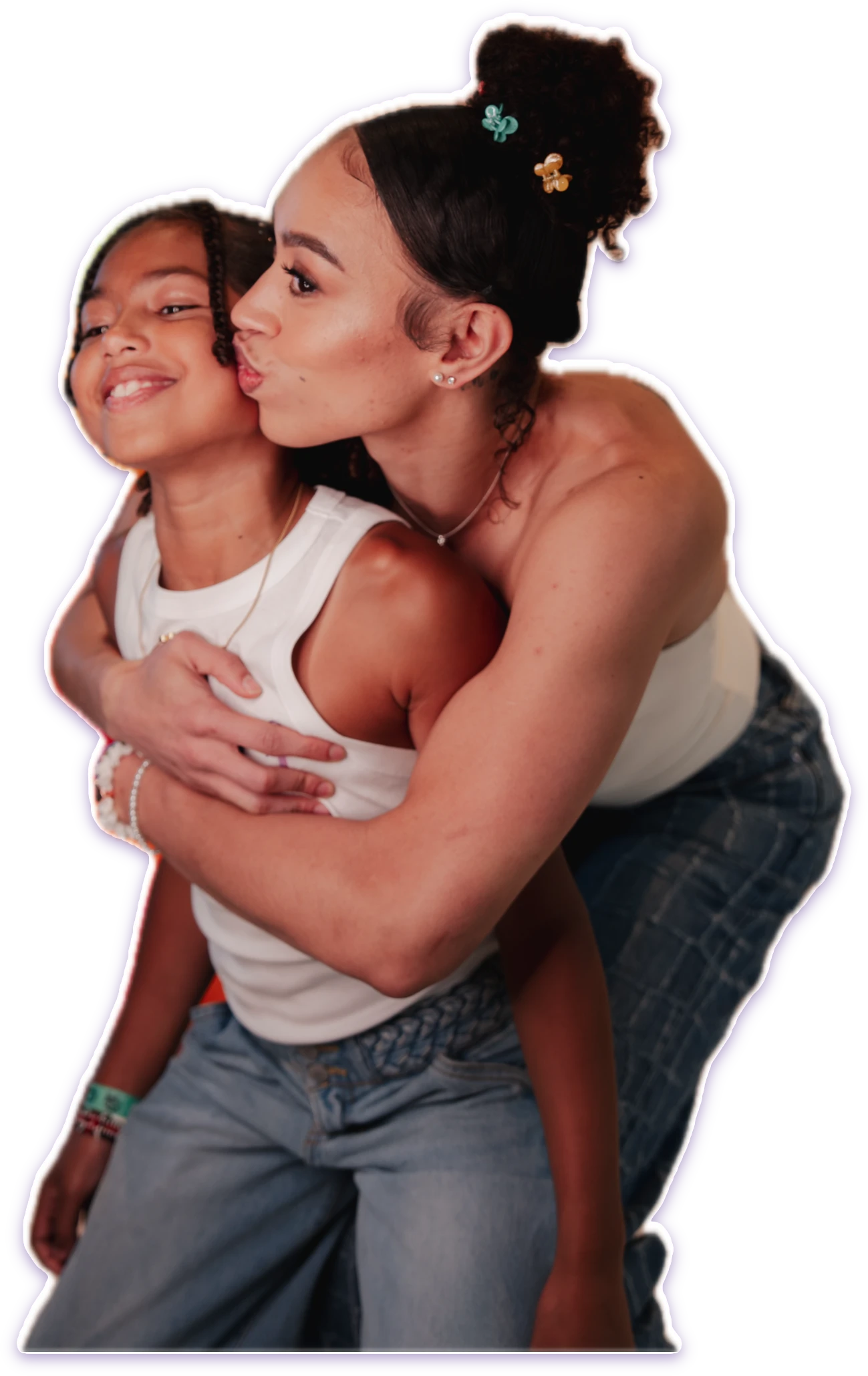 Dearica hugging Amaya from behind and kissing her on the cheek